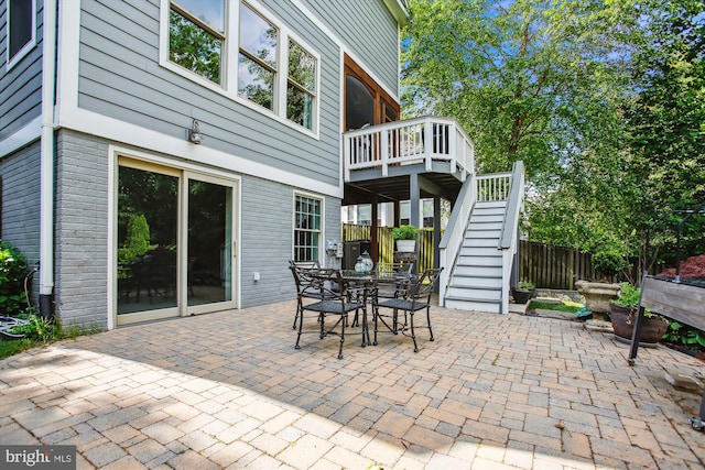 2371 N Edgewood St, Arlington, VA 22207 - view of patio / terrace featuring stairway, a wooden deck, and outdoor dining space