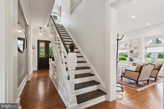 1202 W Wynnewood Rd Unit 1, Wynnewood, PA 19096 - staircase with plenty of natural light, wood finished floors, crown molding, baseboards, and recessed lighting