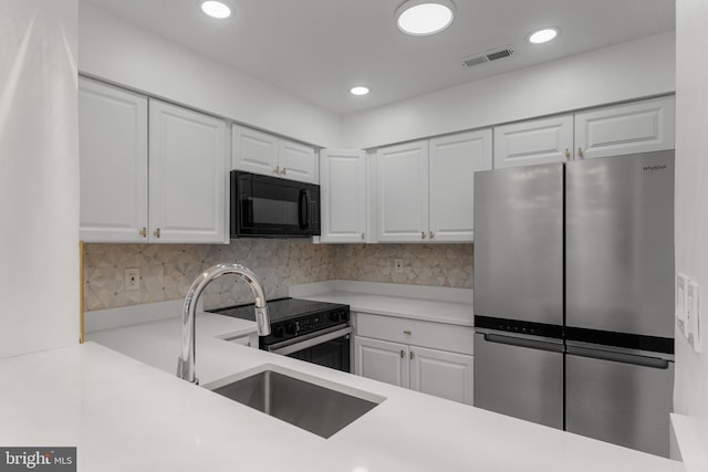 20036 Appledowre Cir Unit 450, Germantown, MD 20876 - kitchen with appliances with stainless steel finishes, a sink, light countertops, white cabinets, and recessed lighting