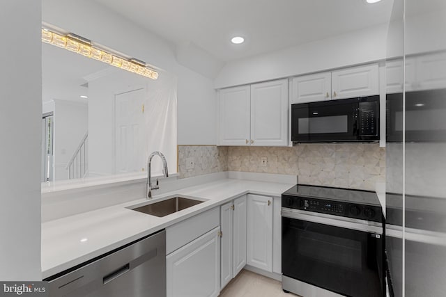 20036 Appledowre Cir Unit 450, Germantown, MD 20876 - kitchen with range with electric stovetop, dishwasher, a sink, black microwave, and white cabinets