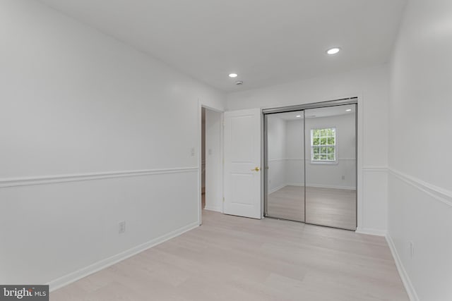 20036 Appledowre Cir Unit 450, Germantown, MD 20876 - unfurnished bedroom featuring light wood-type flooring, recessed lighting, a closet, and baseboards