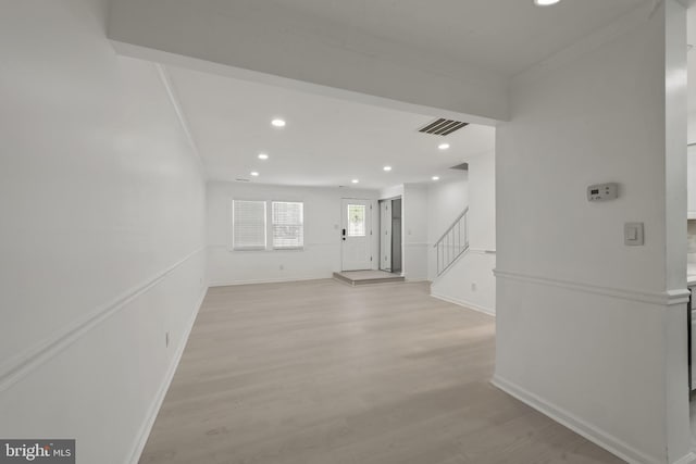 20036 Appledowre Cir Unit 450, Germantown, MD 20876 - spare room featuring recessed lighting, light wood finished floors, stairway, baseboards, and crown molding