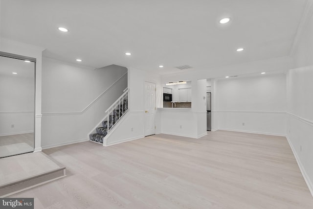 20036 Appledowre Cir Unit 450, Germantown, MD 20876 - below grade area featuring stairs, light wood-style flooring, recessed lighting, and baseboards