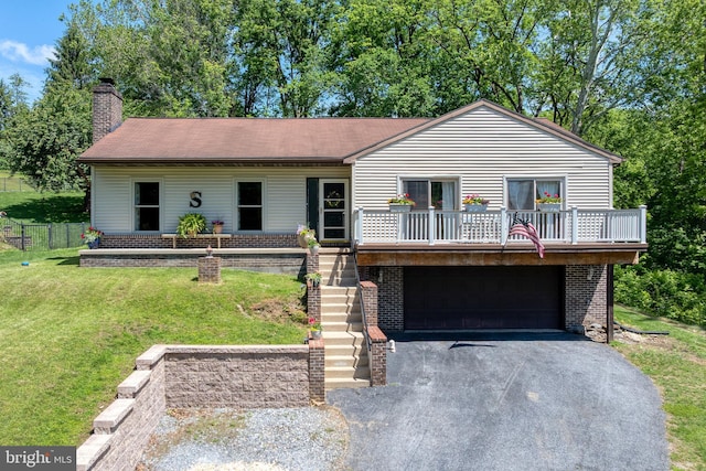 105 Stonewyck Dr, Lancaster, PA 17603 - view of front facade featuring a garage, driveway, stairs, a chimney, and brick siding
