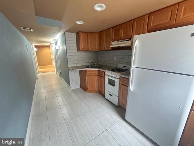 8854 Calvert St, Philadelphia, PA 19152 - kitchen featuring white appliances, under cabinet range hood, a sink, light tile patterned flooring, and recessed lighting