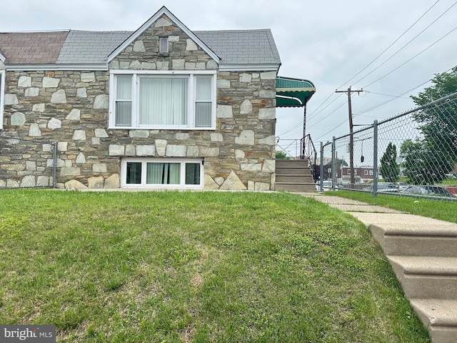 8854 Calvert St, Philadelphia, PA 19152 - view of side of property with stone siding and a high end roof