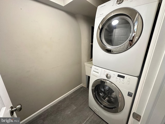 8854 Calvert St, Philadelphia, PA 19152 - laundry room featuring stacked washing machine and dryer and baseboards