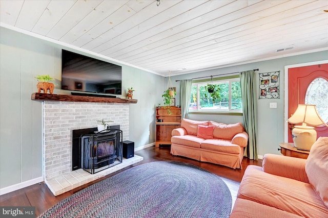 2122 Harkins Rd, Pylesville, MD 21132 - living room featuring wooden ceiling, crown molding, wood finished floors, baseboards, and a brick fireplace