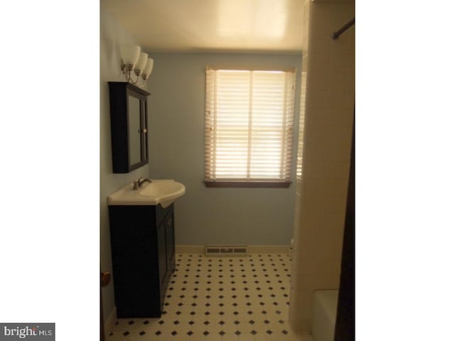 1726 Third St, Thorofare, NJ 08086 - full bath with a shower, vanity, and baseboards