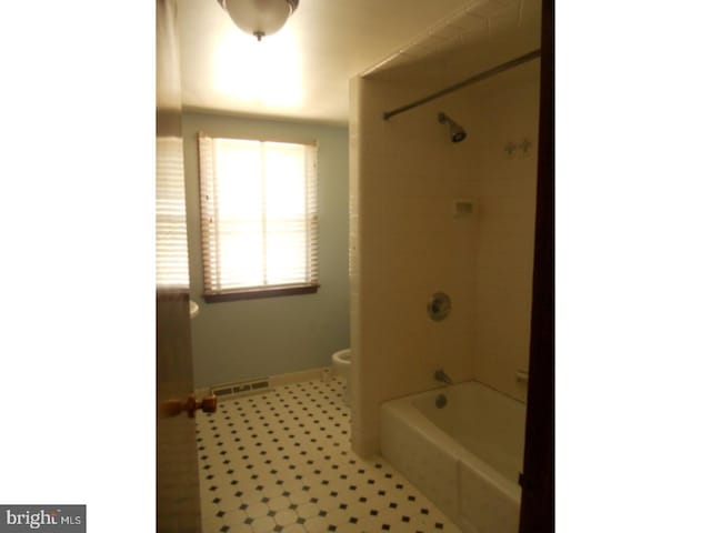 1726 Third St, Thorofare, NJ 08086 - bathroom with toilet, baseboards, and shower / bath combination