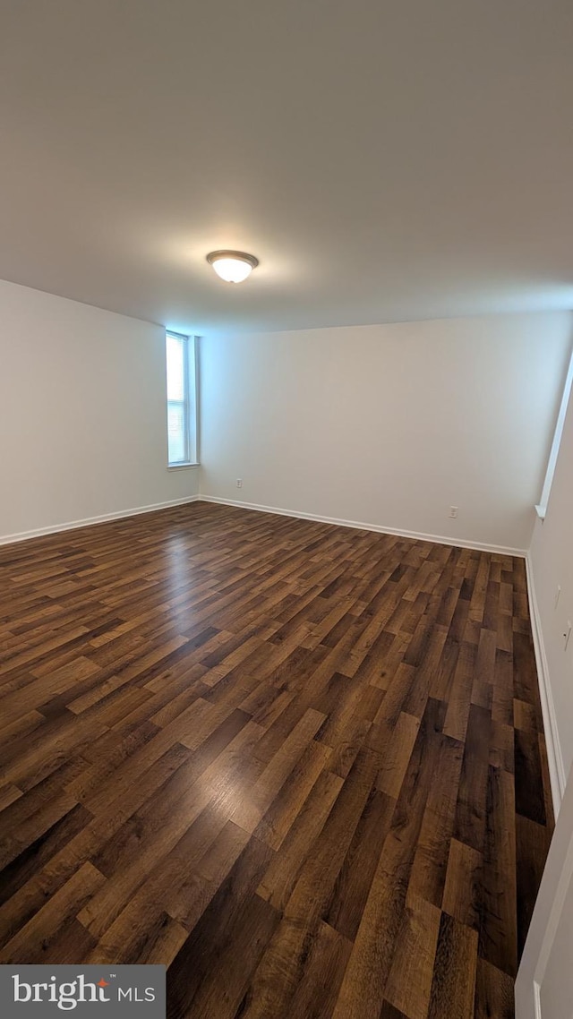 104 Duvall Ln Unit 30-104, Gaithersburg, MD 20877 - spare room featuring dark wood-type flooring and baseboards