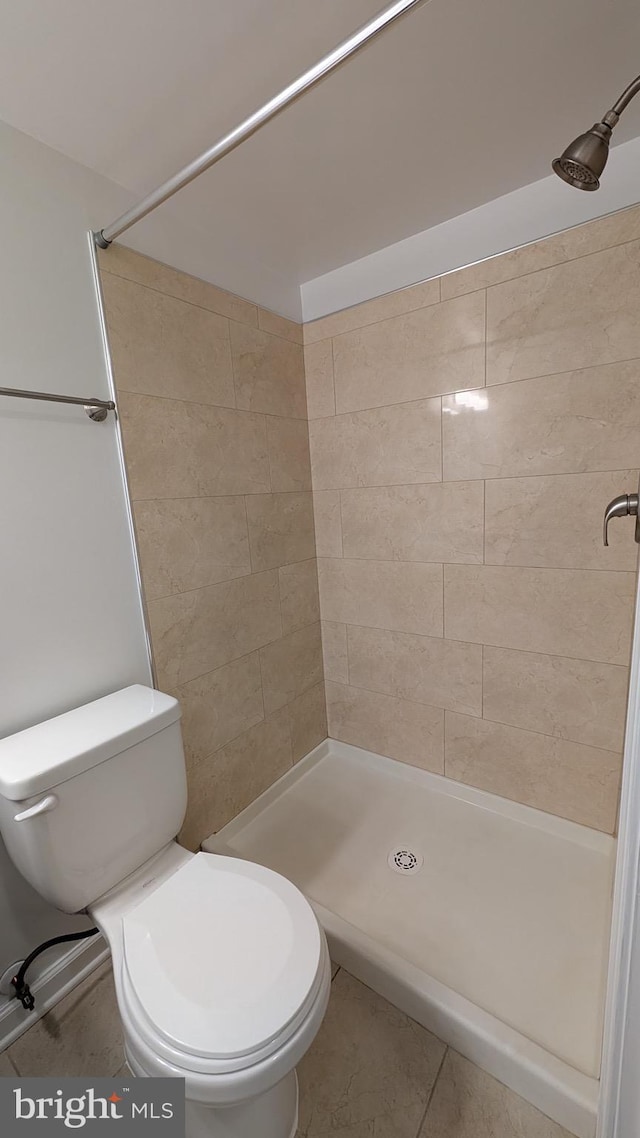 104 Duvall Ln Unit 30-104, Gaithersburg, MD 20877 - full bathroom featuring toilet, tiled shower, and tile patterned flooring