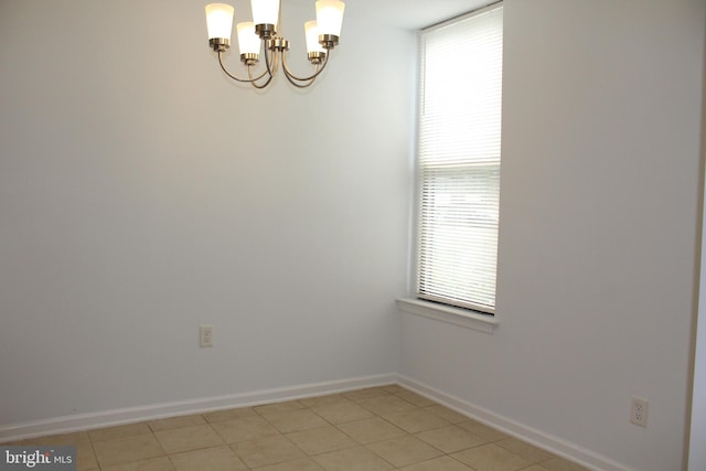 104 Duvall Ln Unit 30-104, Gaithersburg, MD 20877 - spare room with a chandelier, baseboards, and light tile patterned flooring