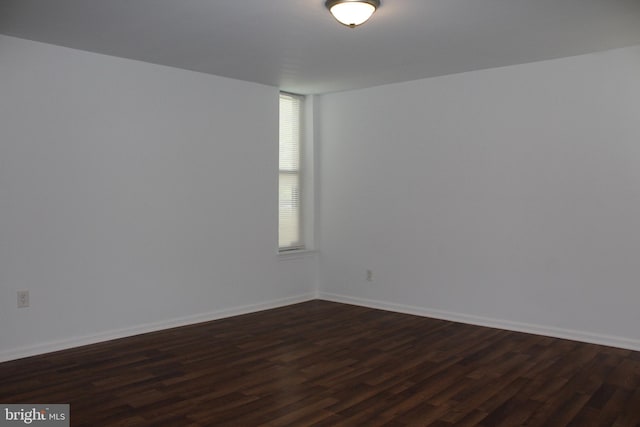 104 Duvall Ln Unit 30-104, Gaithersburg, MD 20877 - empty room with dark wood finished floors and baseboards