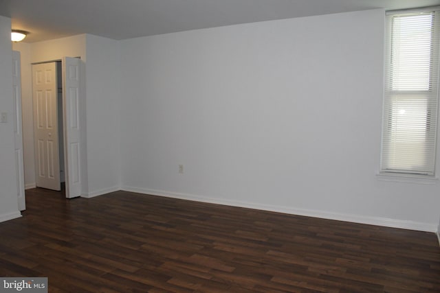 104 Duvall Ln Unit 30-104, Gaithersburg, MD 20877 - empty room featuring dark wood finished floors and baseboards