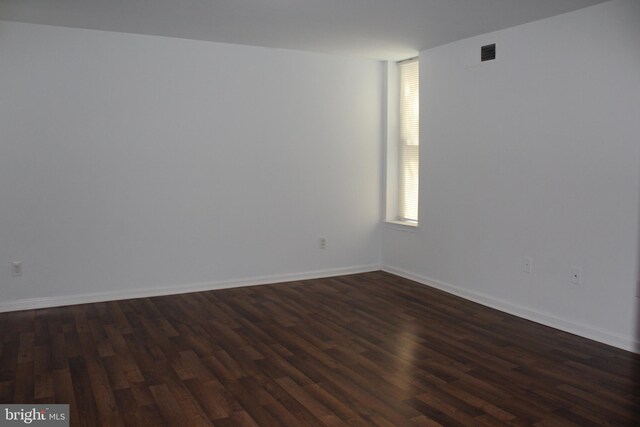104 Duvall Ln Unit 30-104, Gaithersburg, MD 20877 - spare room with dark wood-type flooring and baseboards
