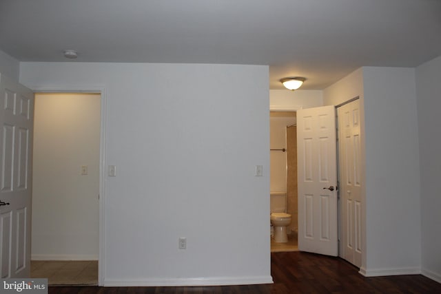 104 Duvall Ln Unit 30-104, Gaithersburg, MD 20877 - spare room featuring dark wood-style floors and baseboards