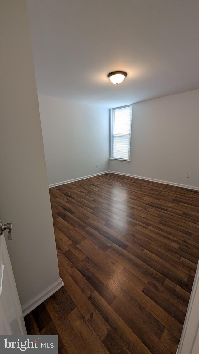 104 Duvall Ln Unit 30-104, Gaithersburg, MD 20877 - unfurnished room featuring dark wood-style flooring and baseboards