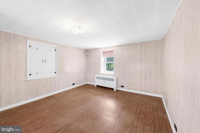 2138 Hill Rd, Perkiomenville, PA 18074 - spare room featuring radiator heating unit, wood finished floors, and baseboards