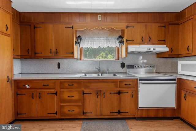 2138 Hill Rd, Perkiomenville, PA 18074 - kitchen with white appliances, a sink, under cabinet range hood, light countertops, and backsplash
