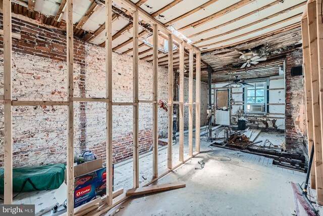 12 Kresson St N, Baltimore, MD 21224 - below grade area with a ceiling fan and cooling unit