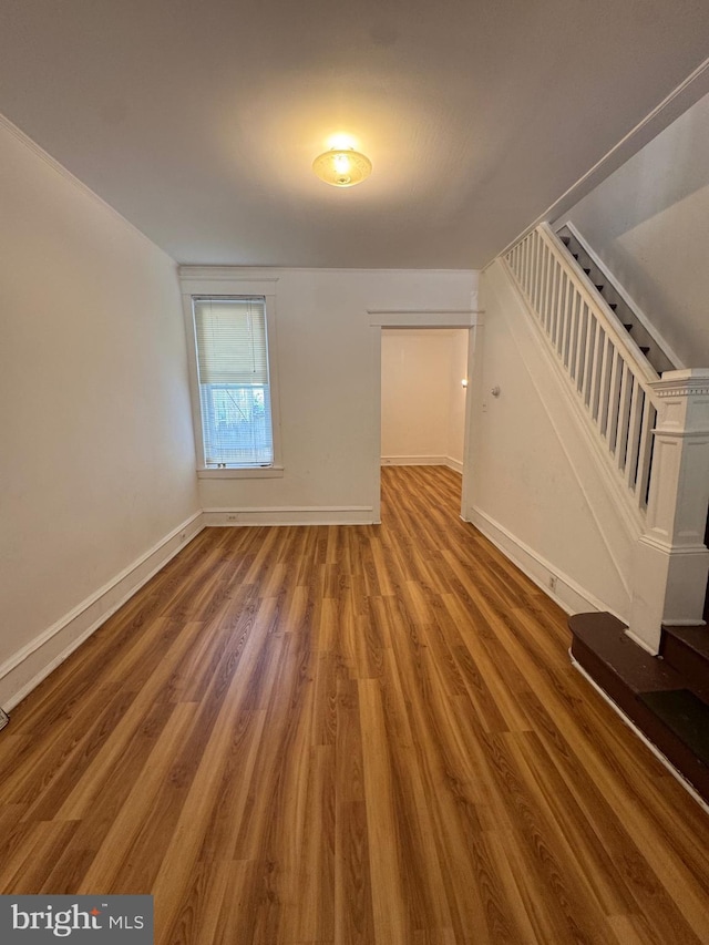 423 Trenton Ave, Camden, NJ 08103 - unfurnished living room with wood finished floors, baseboards, and stairway