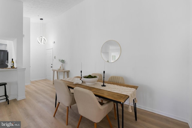 1490 Greenbriar Cir Unit 1-1490, Pikesville, MD 21208 - dining area featuring light wood-type flooring and baseboards