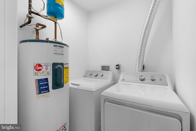1490 Greenbriar Cir Unit 1-1490, Pikesville, MD 21208 - laundry room featuring water heater and separate washer and dryer