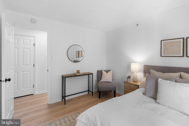 1490 Greenbriar Cir Unit 1-1490, Pikesville, MD 21208 - bedroom with wood finished floors and baseboards