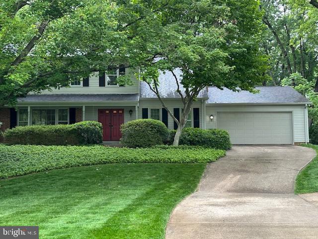 1881 Cold Creek Ct, Vienna, VA 22182 - view of front of home with a front lawn, concrete driveway, and an attached garage