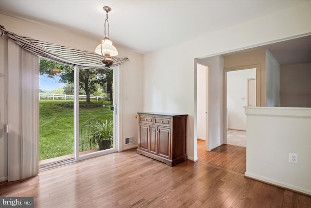 1881 Cold Creek Ct, Vienna, VA 22182 - unfurnished dining area with light wood-style floors and baseboards
