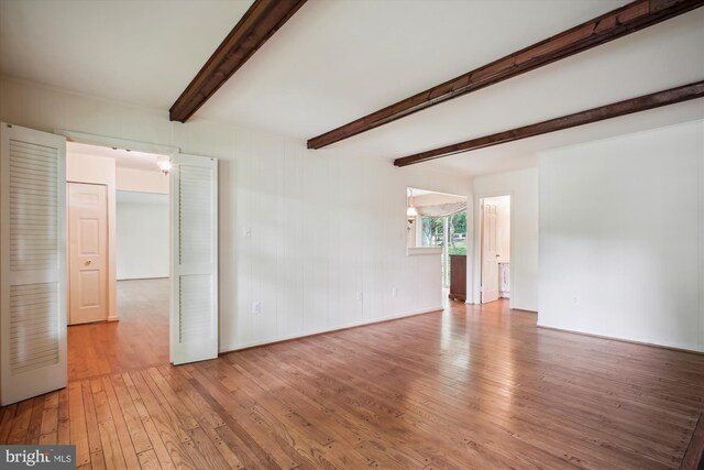 1881 Cold Creek Ct, Vienna, VA 22182 - empty room with hardwood / wood-style flooring, beamed ceiling, and baseboards