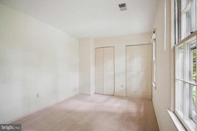 1881 Cold Creek Ct, Vienna, VA 22182 - unfurnished bedroom featuring multiple closets and carpet floors