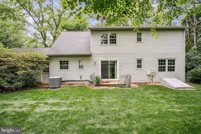 1881 Cold Creek Ct, Vienna, VA 22182 - back of house with central AC, a lawn, and roof with shingles