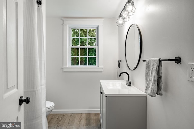 618 Ruth, Upper Chichester, PA 19014 - full bathroom with vanity, wood finished floors, toilet, and baseboards