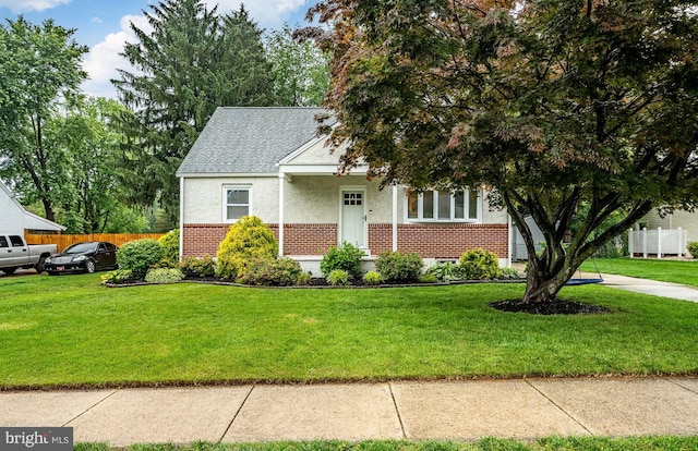 618 Ruth, Upper Chichester, PA 19014 - view of property hidden behind natural elements featuring brick siding, stucco siding, and roof with shingles