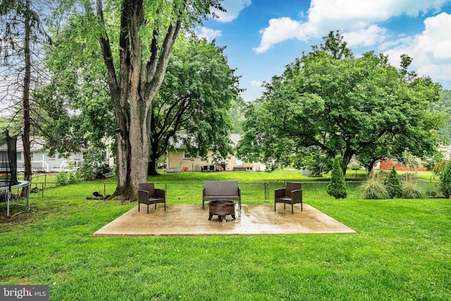 618 Ruth, Upper Chichester, PA 19014 - view of yard featuring a fire pit, a patio area, and a trampoline