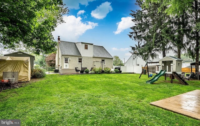 618 Ruth, Upper Chichester, PA 19014 - rear view of property with a playground, a chimney, and cooling unit