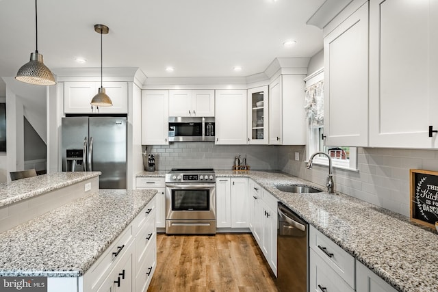 618 Ruth, Upper Chichester, PA 19014 - kitchen featuring appliances with stainless steel finishes, a sink, white cabinets, backsplash, and recessed lighting