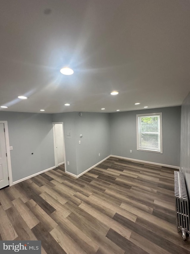 1500 Centre Ave, Reading, PA 19601 - below grade area featuring wood finished floors, baseboards, recessed lighting, and radiator heating unit