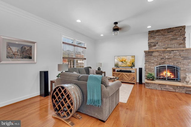 620 Cypress Ln, Severna Park, MD 21146 - living area with wood finished floors, crown molding, a stone fireplace, recessed lighting, and a ceiling fan