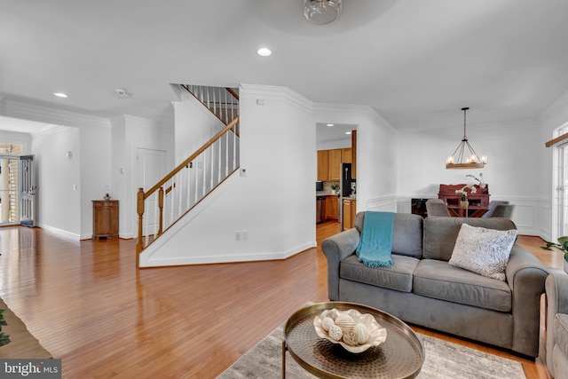 620 Cypress Ln, Severna Park, MD 21146 - living area featuring a chandelier, light wood-style floors, stairway, ornamental molding, and recessed lighting