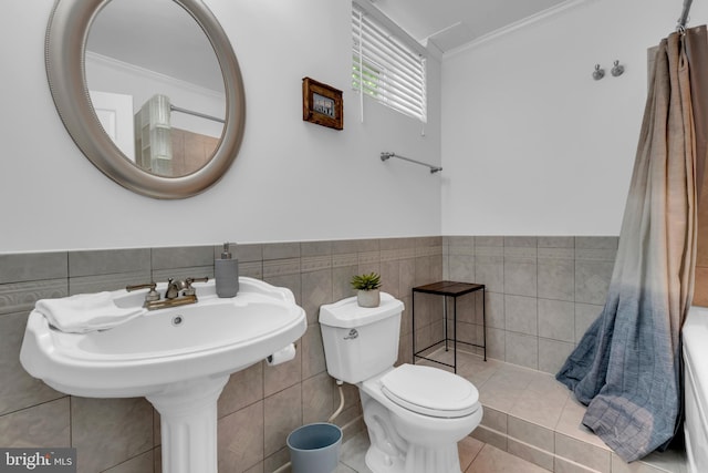 620 Cypress Ln, Severna Park, MD 21146 - bathroom featuring tile walls, crown molding, a wainscoted wall, and tile patterned flooring