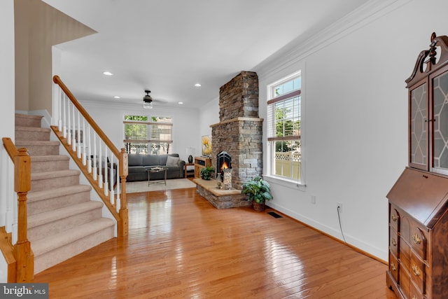 620 Cypress Ln, Severna Park, MD 21146 - living area featuring plenty of natural light, stairs, light wood-type flooring, a stone fireplace, and recessed lighting