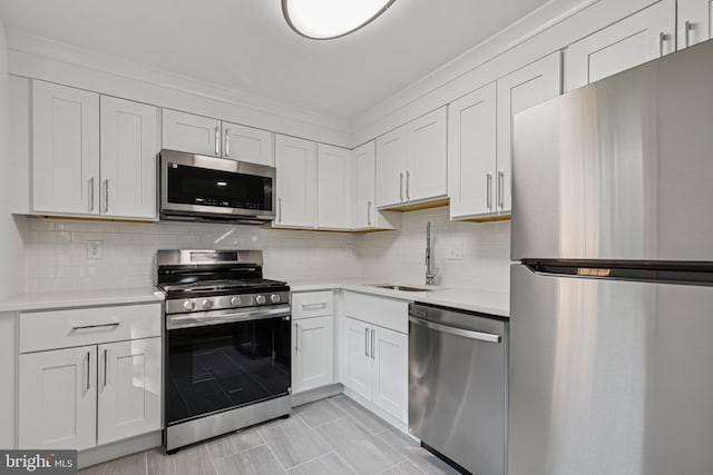 1329 Potomac Heights Dr Unit 36, Fort Washington, MD 20744 - kitchen with appliances with stainless steel finishes, a sink, light countertops, and white cabinetry