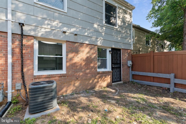 1329 Potomac Heights Dr Unit 36, Fort Washington, MD 20744 - view of property exterior with central AC unit and brick siding