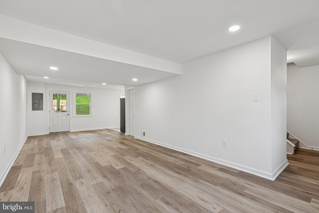 1329 Potomac Heights Dr Unit 36, Fort Washington, MD 20744 - unfurnished living room featuring electric panel, light wood-style flooring, recessed lighting, stairway, and baseboards
