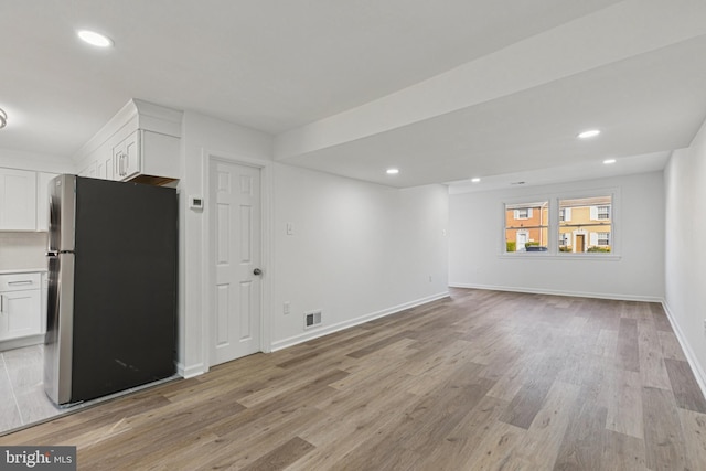 1329 Potomac Heights Dr Unit 36, Fort Washington, MD 20744 - unfurnished living room with light wood-style floors, recessed lighting, and baseboards