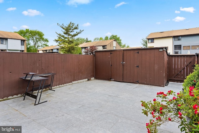 372 Irvington Pl, East Windsor, NJ 08520 - view of patio featuring a gate and a residential view