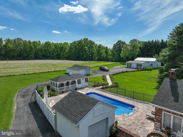 665 Bayard Rd, Lothian, MD 20711 - view of pool featuring an outbuilding, a patio area, a storage structure, and a view of rural / pastoral area